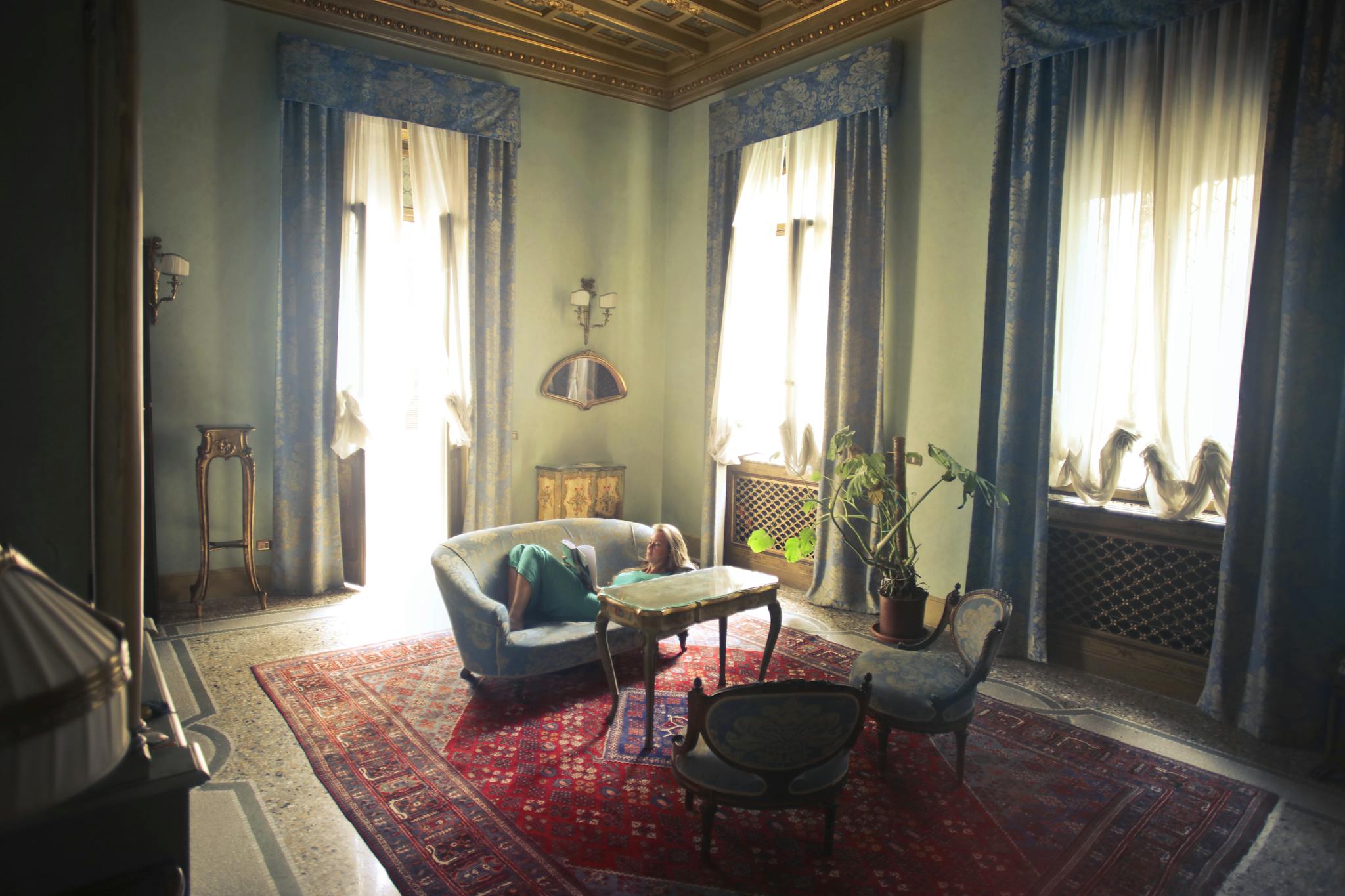 A tranquil and elegant vintage living room featuring classic furniture and rich decor.