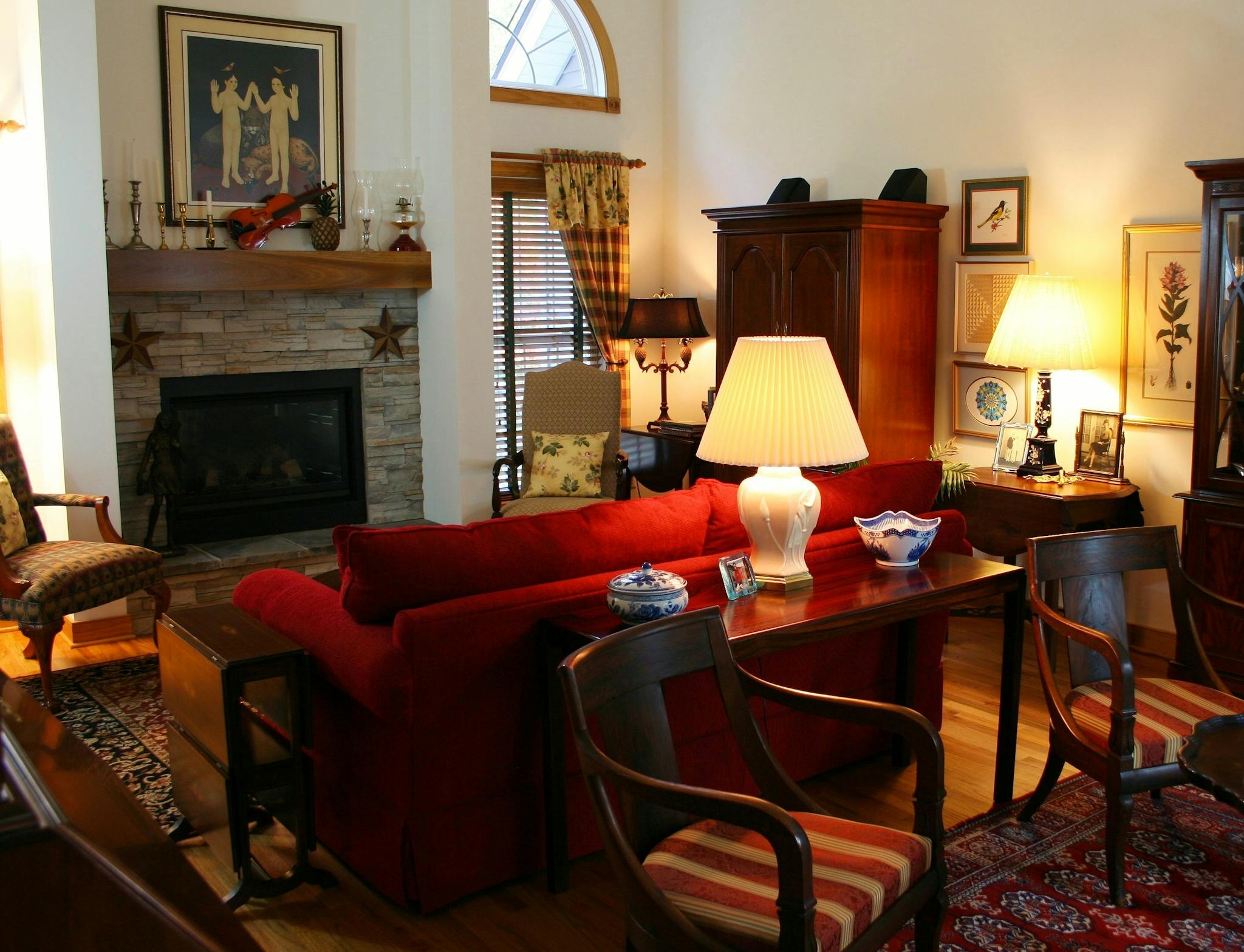 Warm and inviting living room featuring classic furniture and a fireplace, perfect for cozy evenings.